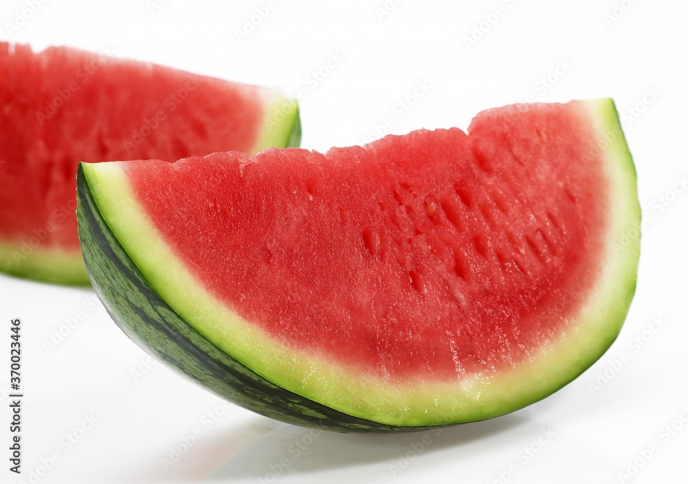 Watermelon, citrullus lanatus, Against White Background Watermelon, citrullus lanatus, Against White Background