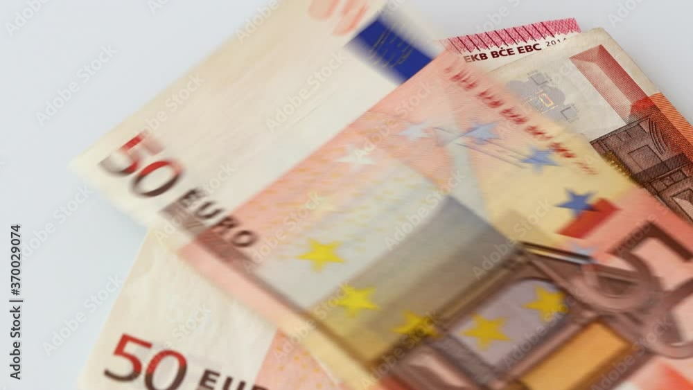 European money, Euro, Various banknotes, held in the hand and put away, one at a time, on the table European money, Euro, Various banknotes, held in the hand and put away, one at a time, on the table