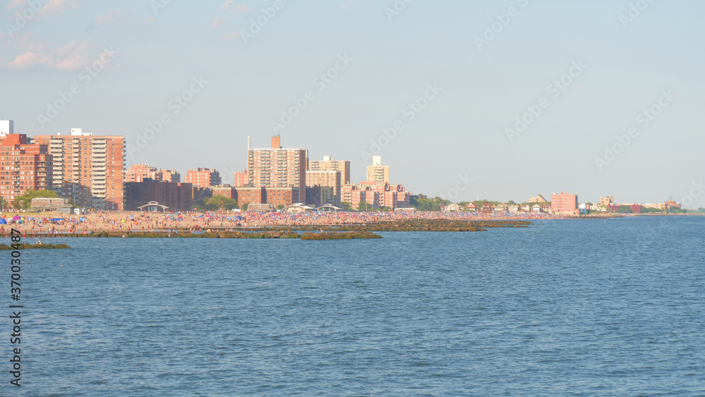 landscape of beach , unrecognized people at coney island beach NY