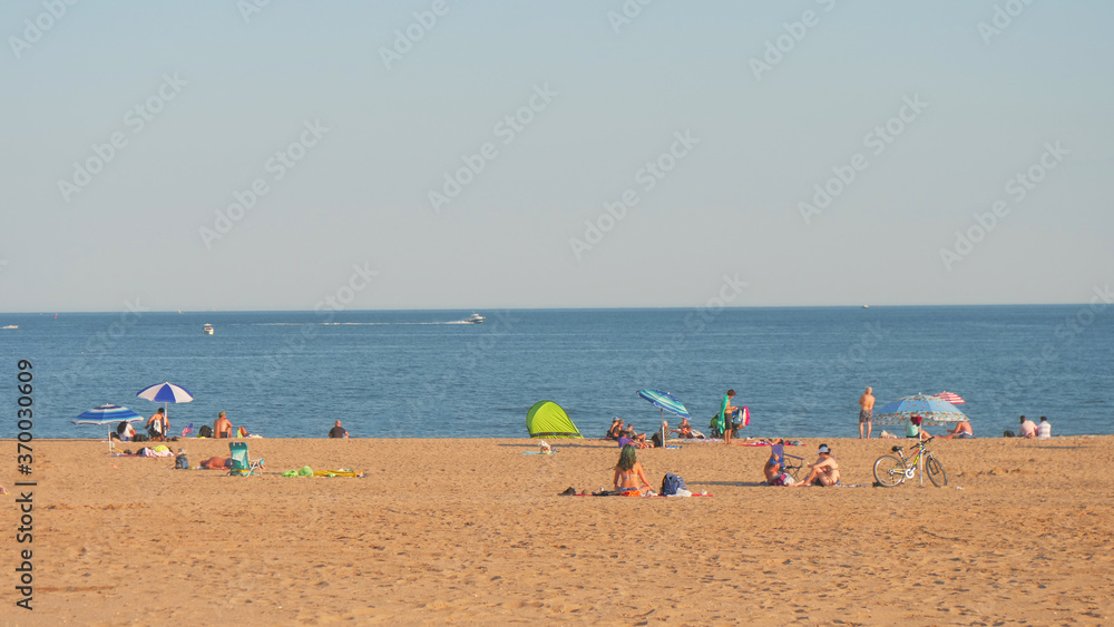 landscape of beach , unrecognized people at coney island beach NY