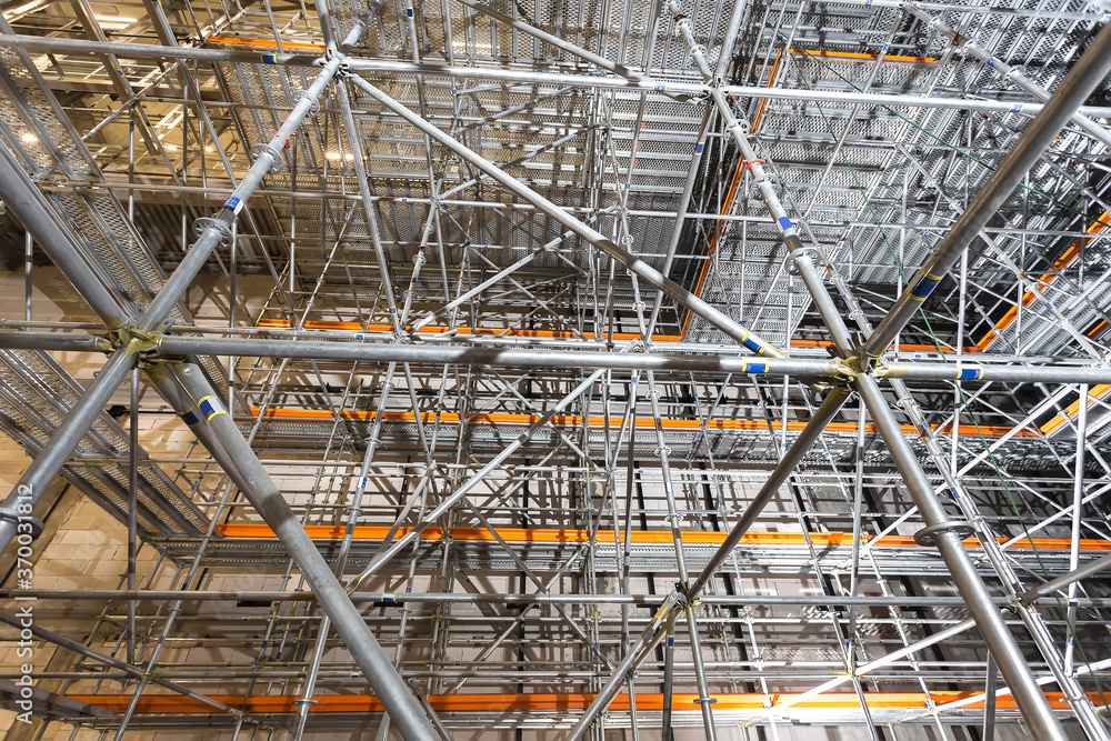 multi-level construction structure made of rafters. Connected sections of steel pipes with each other.