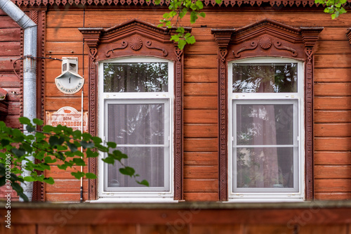 old wooden windows with beautiful carved platbands