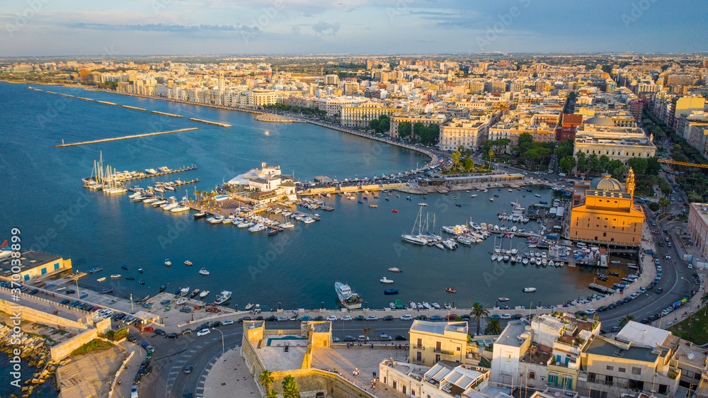 Φωτογραφία Beautiful panoramic aerial view photo from flying drone at sunset to Bari Apulia City port boats and yachts Sea Coastline, Teatro Margherita, and Bari city skyline