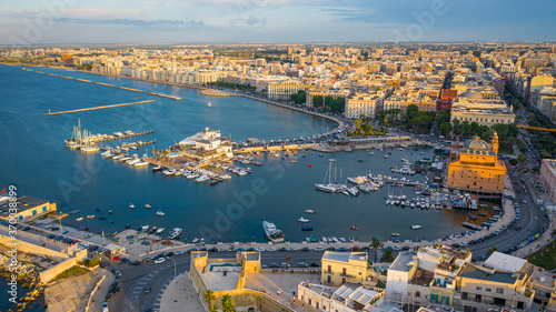 Canvastavla Beautiful panoramic aerial view photo from flying drone at sunset to Bari Apulia City port boats and yachts Sea Coastline, Teatro Margherita, and Bari city skyline
