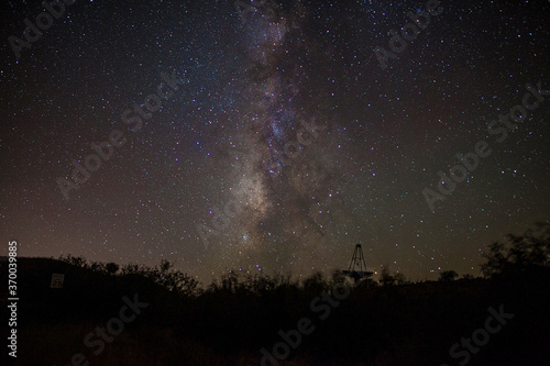 Milky Way stars above a large parabolic telescope