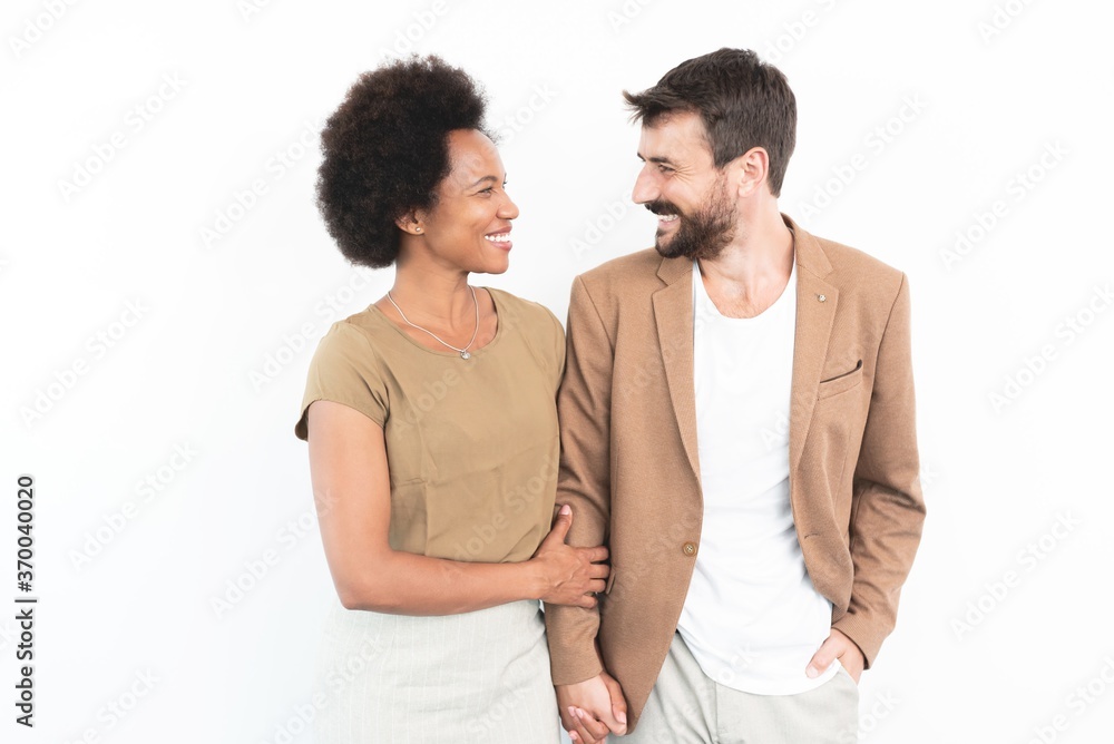 Couple holding hands and looking at each other Couple holding hands and looking at each other