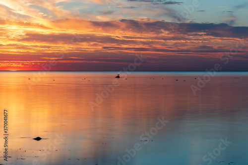 sunset over the sea with reflection in the water. 