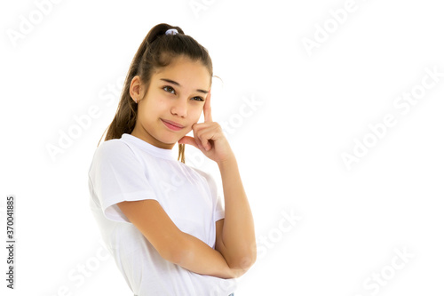 Emotional little girl in a clean white T-shirt.