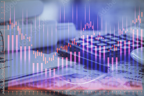 Double exposure of financial chart drawings and desk with open notebook background. Concept of forex market © peshkova