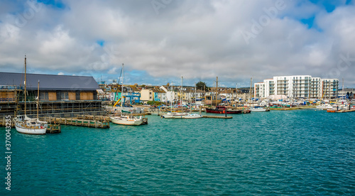 A view towards boats moored on the north bank of the River Adur at Shoreham, Sussex, UK