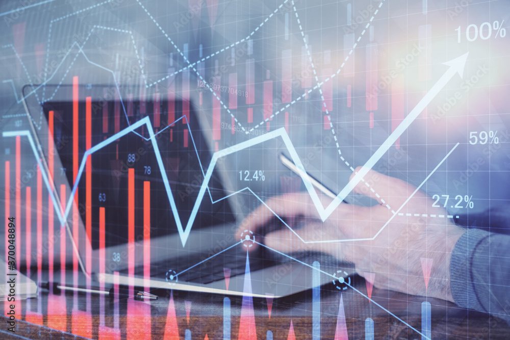 Double exposure of man's hands holding and using a digital device and forex graph drawing. Financial market concept. Double exposure of man's hands holding and using a digital device and forex graph drawing. Financial market concept.