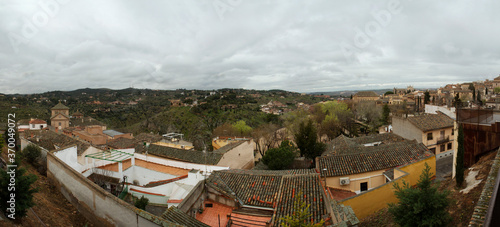 Fisheye lens shot. Architecture. Cityscape. Panorama view of the town and buildings under a cloudy sky in Toledo, Spain.