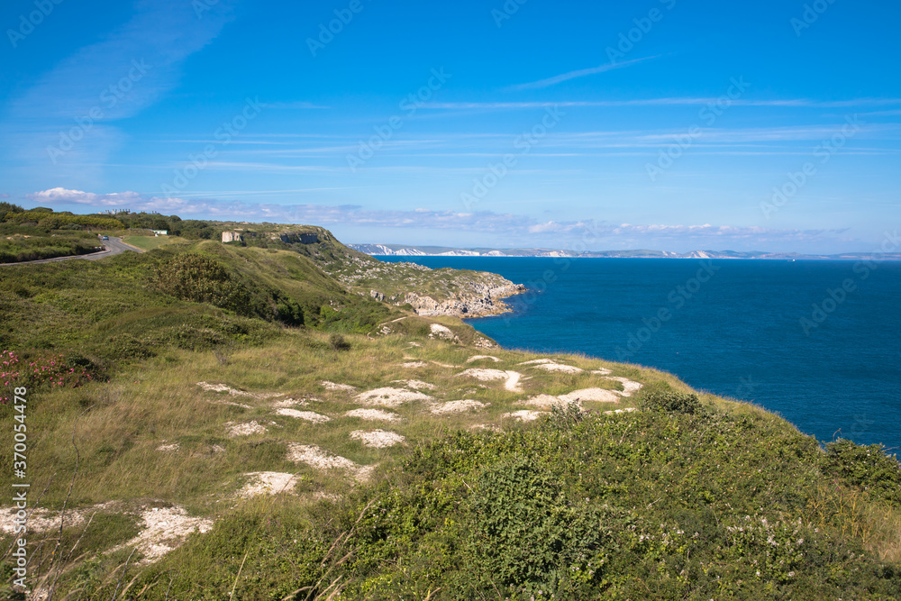 Views of the coast of Isle of Portland with white cliffs of Dorset in the background, Dorset, UK
