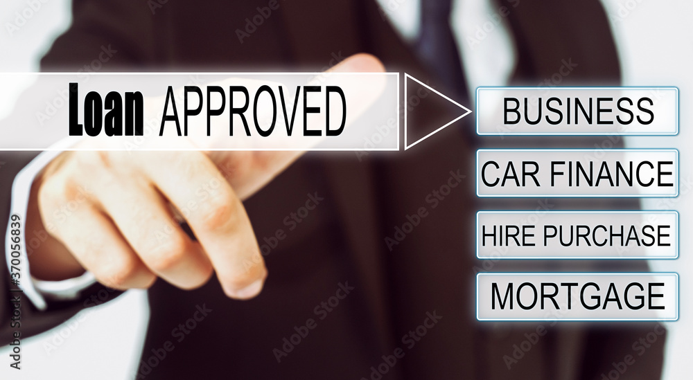 Businessman presses button on the interactive screen with the inscription - Loan APPROVED Businessman presses button on the interactive screen with the inscription - Loan APPROVED