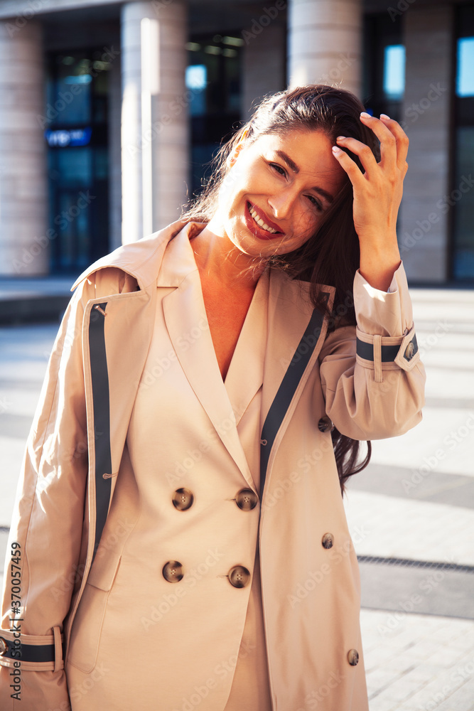 Fototapeta premium young pretty brunette woman in fashion suit at business building posing cheerful, lifestyle people concept