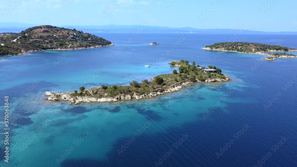 Tropic islands with trees in tranquil blue sea. Exotic destination for travel. Aerial view Tropic islands with trees in tranquil blue sea. Exotic destination for travel. Aerial view