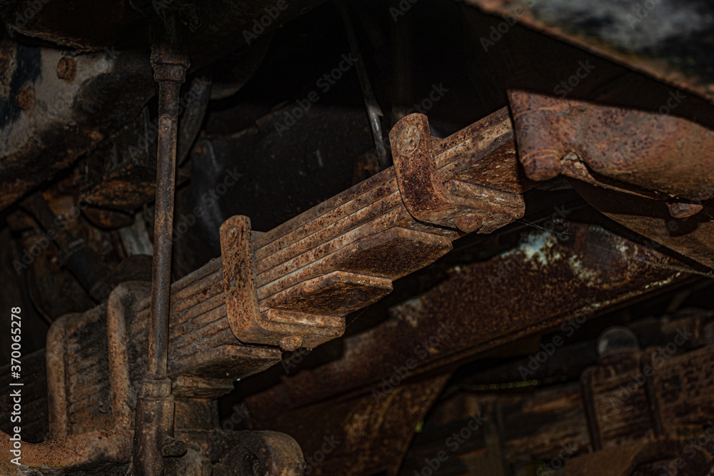 Old and very rusted leaf spring and suspension on an old truck in Broome County NY Old and very rusted leaf spring and suspension on an old truck in Broome County NY