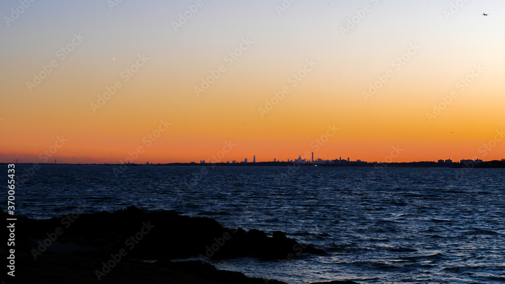Beautiful Sunset over the Long Island Sound with New York City in the background Beautiful Sunset over the Long Island Sound with New York City in the background