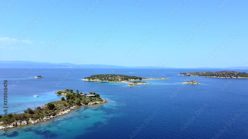 Group of exotic islands in blue tranquil open sea. Exotic travel destination. Aerial view Group of exotic islands in blue tranquil open sea. Exotic travel destination. Aerial view