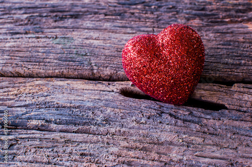 Heart for Valentine s day Red heart-shaped on an old dark wooden texture background and copy space.