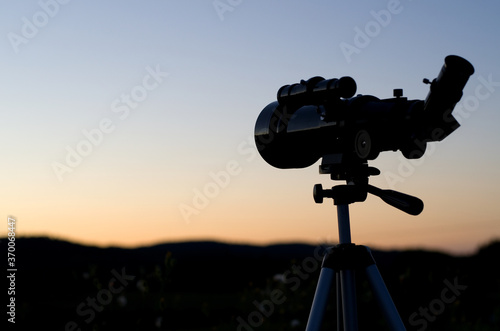 Silhouette of a Telescope at Sunset