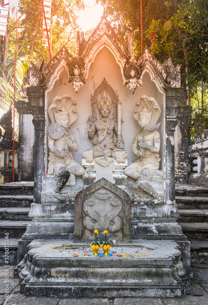 Phayao, Thailand - Dec 1, 2019: Indra and Follower Statue on Stone Platform with Natural Light in Analayo Temple or Wat Analayo at Phayao Thailand in Portrait View