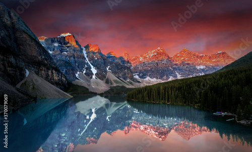 Dramatic sunrise during first break of dawn at Moraine Lake in the Canadian Rockies of Banff National Park. © ronniechua