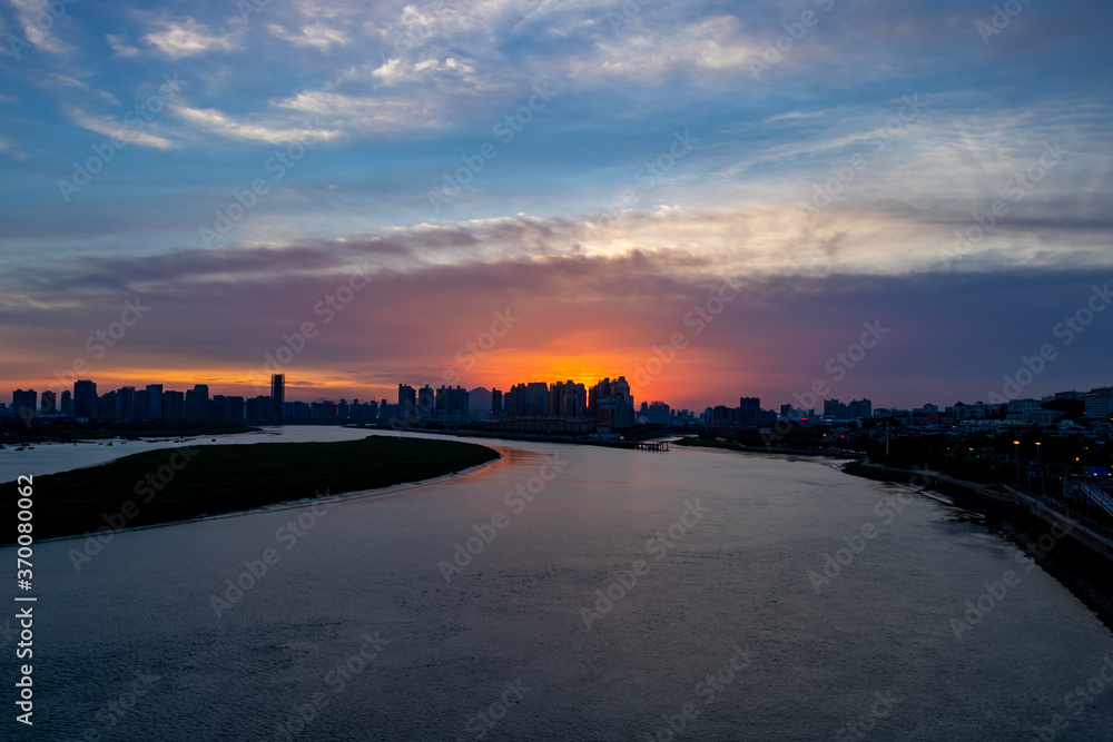 On August 7, 2020, the scenery of Quanzhou Bay in China. Urban architecture by the river.