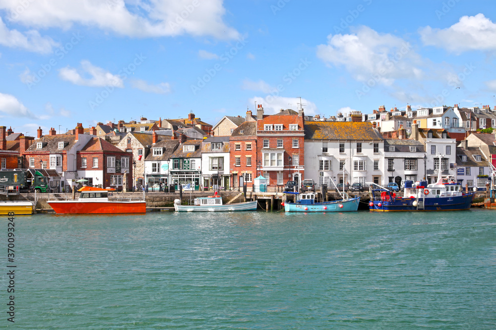 Sailing boats in the old town of Weymouth Harbour in Dorset, England, UK. Sailing boats in the old town of Weymouth Harbour in Dorset, England, UK.