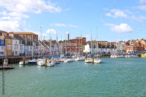 Εκτύπωση καμβά Sailing boats in the old town of Weymouth Harbour in Dorset, England, UK