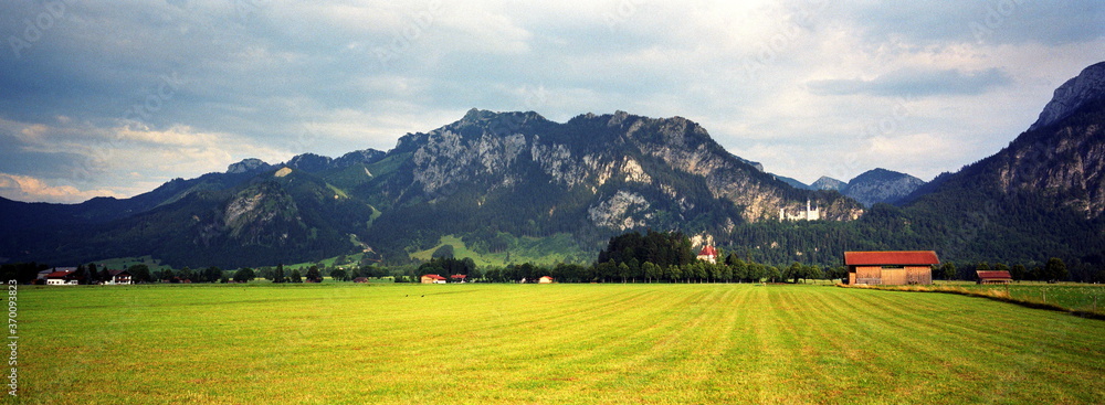 View of The Neuschwanstein Castle with scenic mountain landscape near Fussen in southwest Bavaria, Germany. 