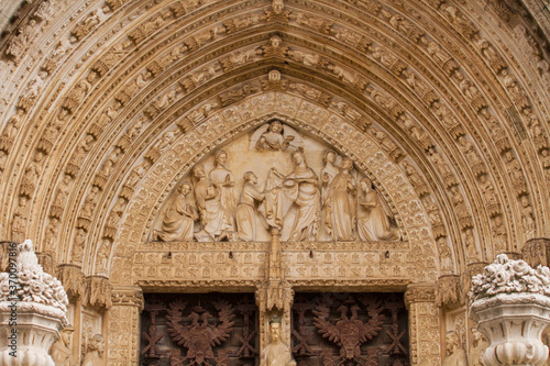 Gothic ancient architecture and design. Closeup view of the textures and sculptures in the Door of Lions in Toledo Cathedral, Spain. 