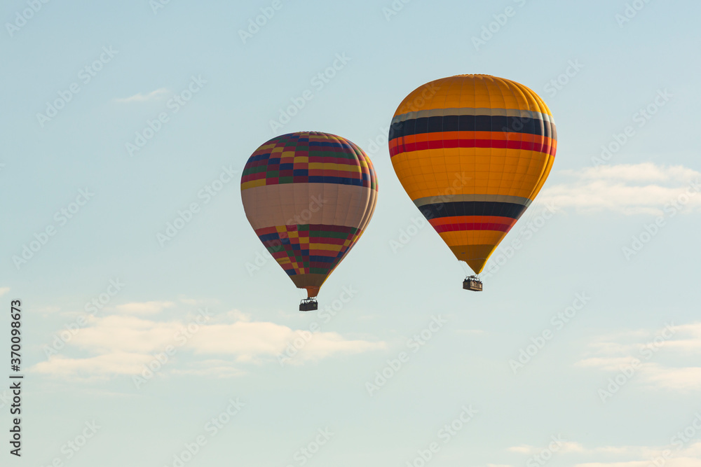 Fototapeta premium Hot air balloons profiled on clear blue sky, in Cappadocia, Turkey