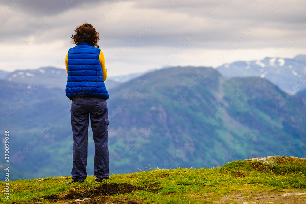 Naklejka premium Tourist enjoy mountains view, Norway