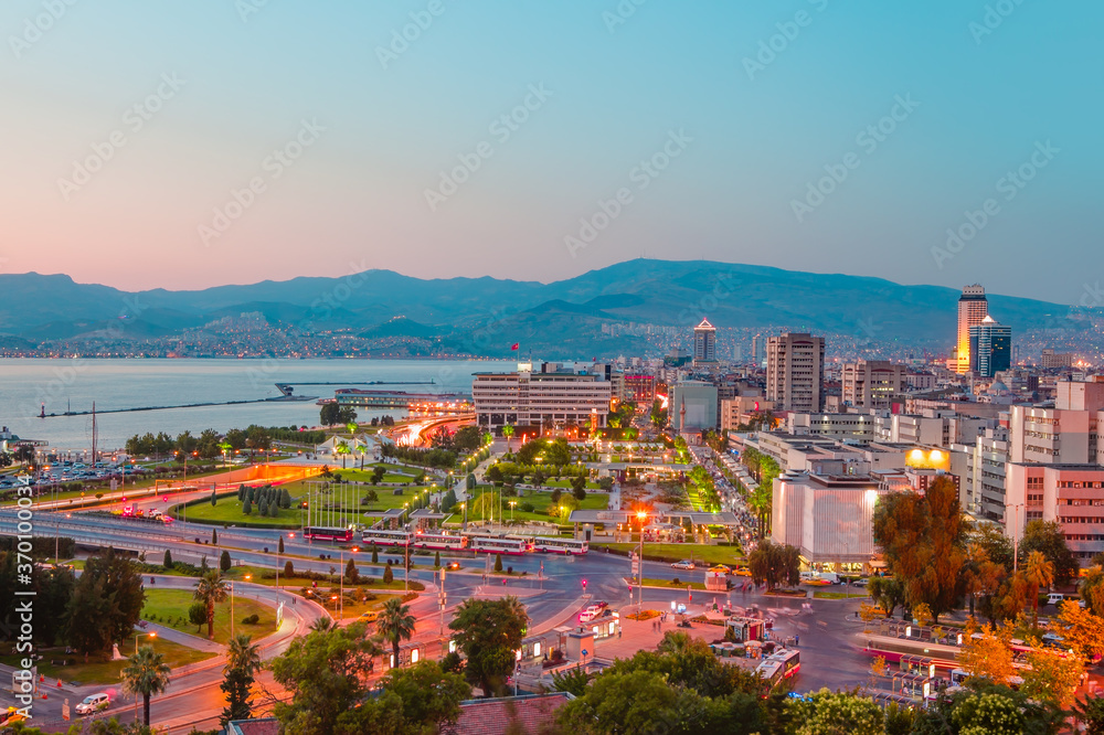 Coastal cityscape with modern buildings under blue sky - Izmir, Turkey