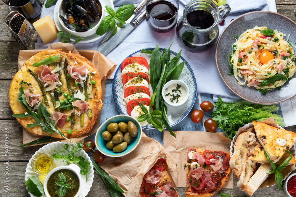 Italian cuisine on rustic wooden table Italian cuisine on rustic wooden table