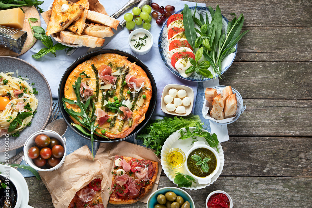 Italian cuisine on rustic wooden table Italian cuisine on rustic wooden table