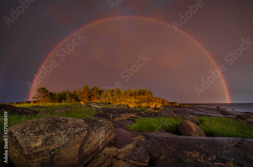 Rainbow over the rocks. Arctic. Kiy Island in the White Sea 