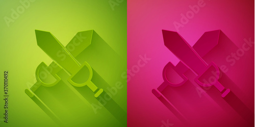 Paper cut Crossed medieval sword icon isolated on green and pink background. Medieval weapon. Paper art style. Vector.