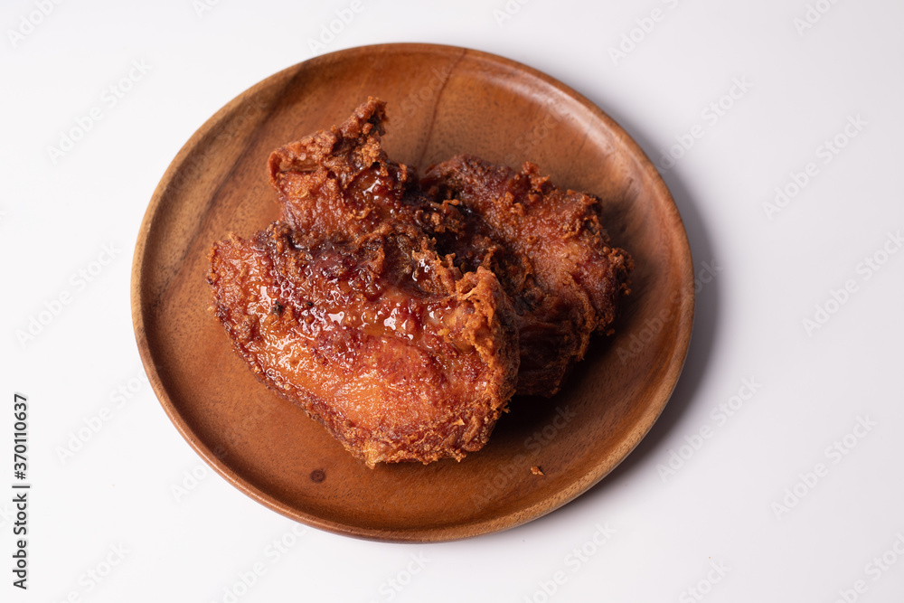 Pork fried rice on a dark tone wooden plate Pork fried rice on a dark tone wooden plate
