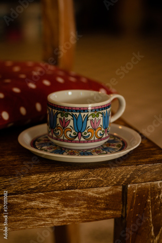 Coffee mug on a wooden chair