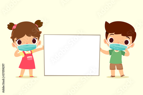 children wearing face mask hold blank sign