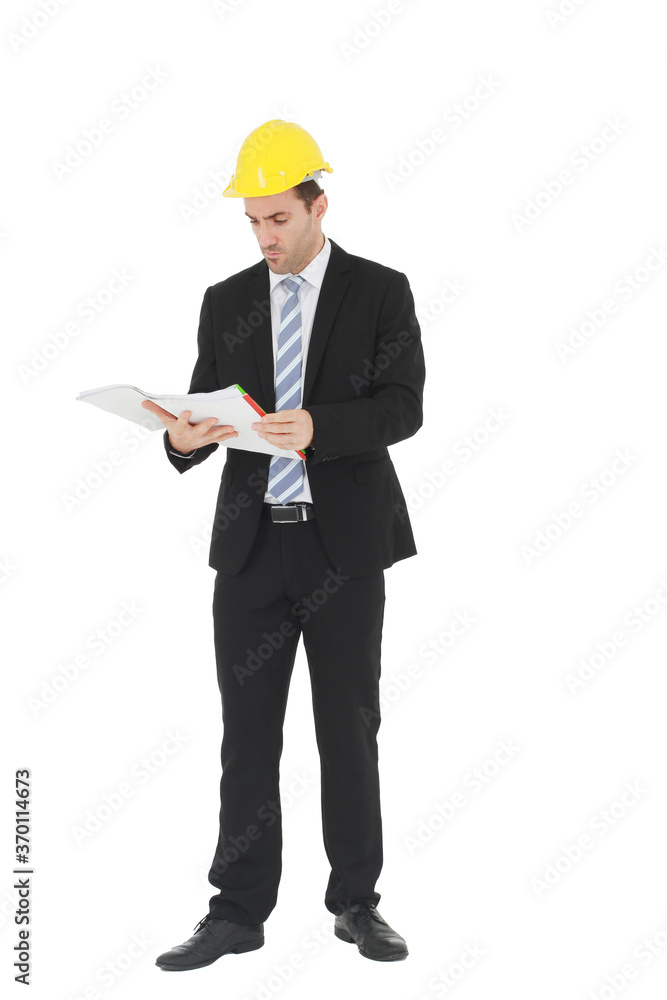 Handsome and smart engineer or architecture in black suit Wearing a yellow safety engineer hat with hand holding construction drawing papers and serious in work isolated on yellow background. Handsome and smart engineer or architecture in black suit Wearing a yellow safety engineer hat with hand holding construction drawing papers and serious in work isolated on yellow background.