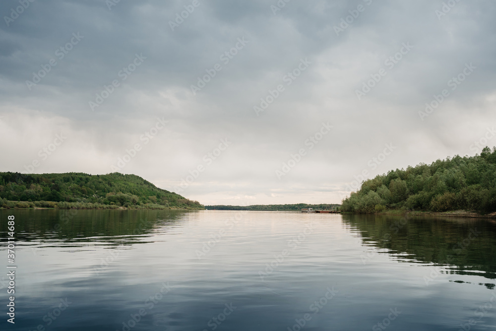 calm river on an overcast day in summer calm river on an overcast day in summer