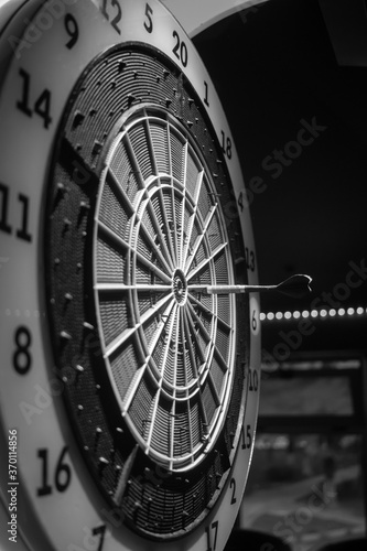 Pikado darts game with the arrow in the middle AM