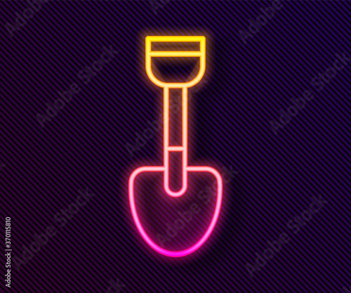 Glowing neon line Shovel toy icon isolated on black background. Vector.