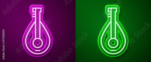 Glowing neon line Traditional musical instrument mandolin icon isolated on purple and green background. Vector.