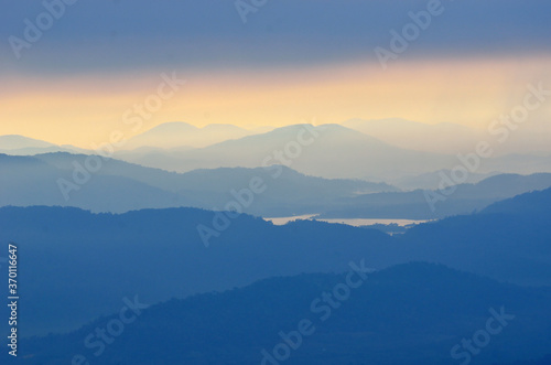 Foggy layered mountain landscape in North of Thailand