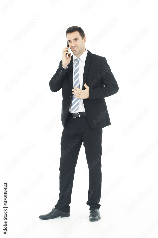 Handsome businessman in a suit hand holding smartphone and talking on the phone isolated on white background.Copy Space Handsome businessman in a suit hand holding smartphone and talking on the phone isolated on white background.Copy Space