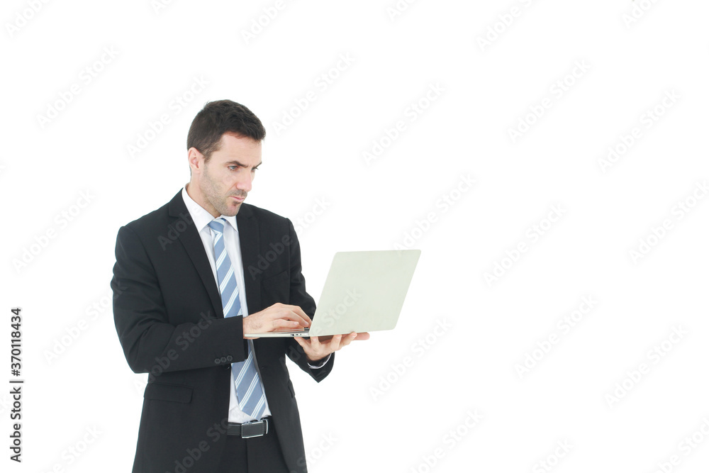 Handsome and smart businessman in black suit isolated hand holding laptop and serious in work on white background. Business and Finance concept. Copy Space